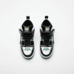 Black and white Batman-themed high-top sneakers for kids with glowing bat logo, velcro straps, and comic-book inspired details.