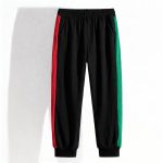 black joggers with striped sides — sporty, bold outfit for boys.