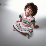 Pink and green “California” polo shirt with matching white pleated skirt and shorts — fun, summery outfit for girls.