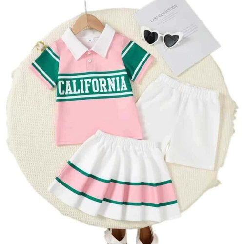 Pink and green “California” polo shirt with matching white pleated skirt and shorts — fun, summery outfit for girls.