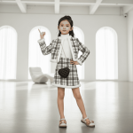 Black and white tweed plaid jacket and skirt set with soft white fleece trim — classic, elegant outfit for girls and teens.