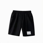 Black shorts — modern, minimalist outfit for boys.