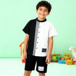 Black and white colorblock button-up shirt with gray stripe + matching black shorts — modern, minimalist outfit for boys.