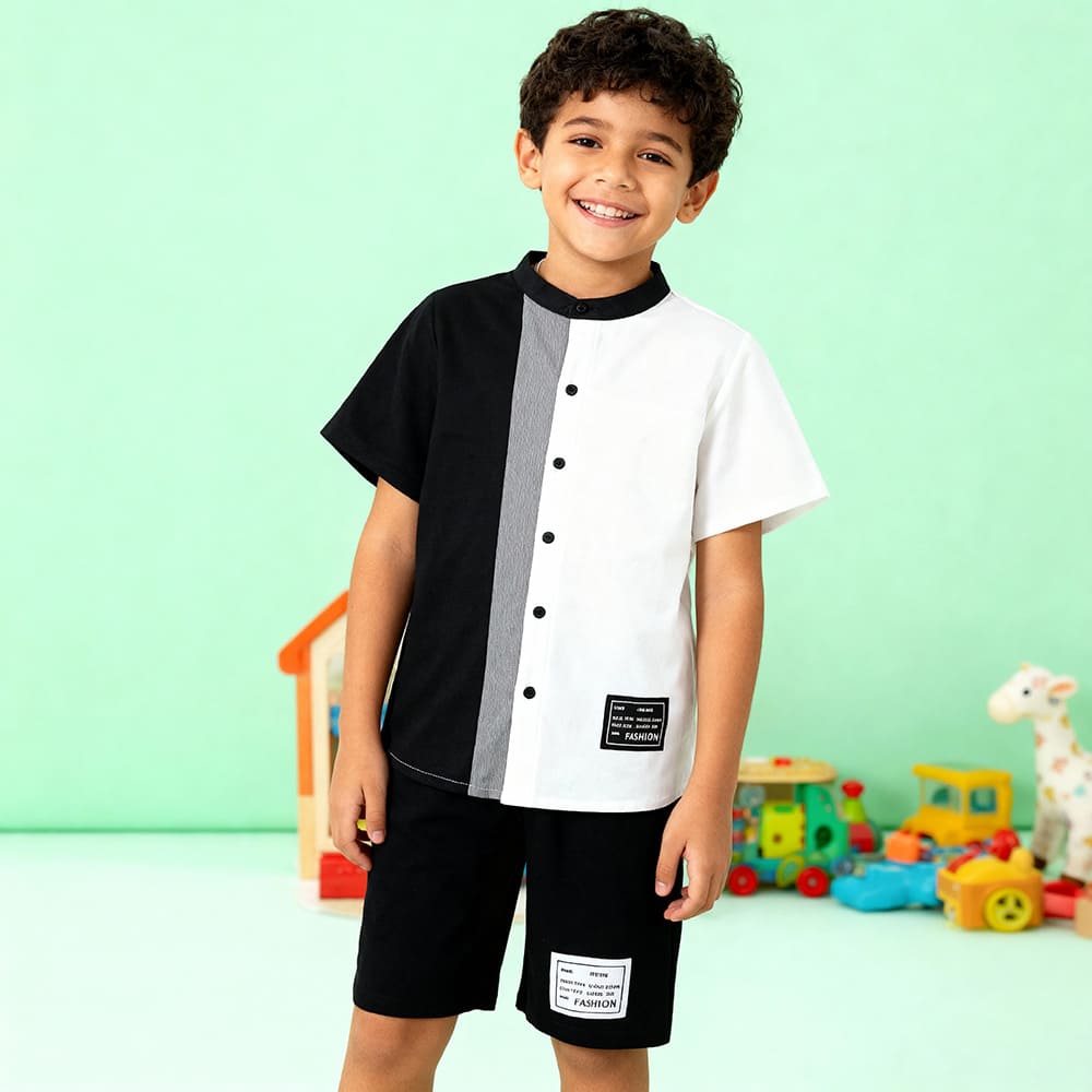 Black and white colorblock button-up shirt with gray stripe + matching black shorts — modern, minimalist outfit for boys.
