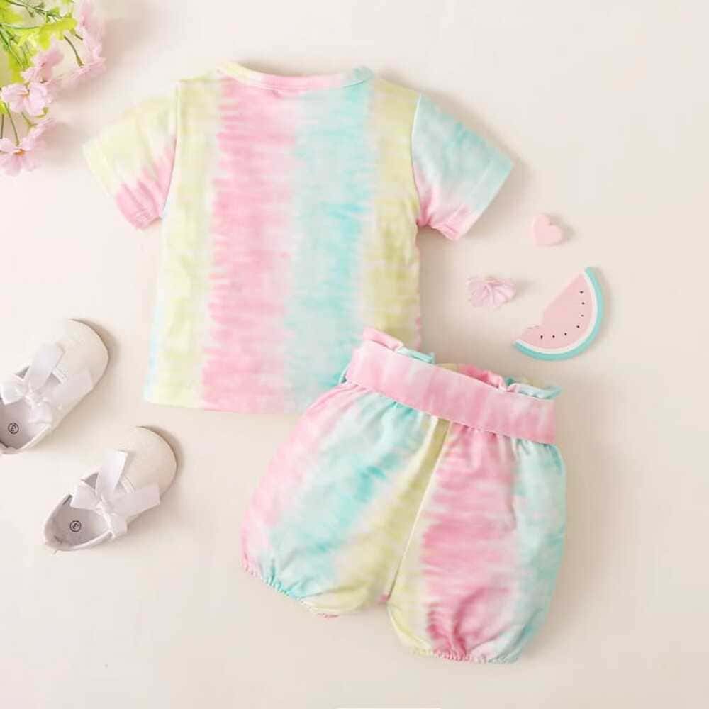 daddys-little-romper-back-styles-by-syl Pastel tie-dye romper with “Daddy’s little” print and matching bow belt — sweet, soft outfit for baby girls.