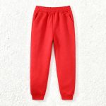 Red kids’ sweatshirt with “DRAGON” graphic and black contrast sleeves, paired with matching red jogger pants — bold, sporty outfit.