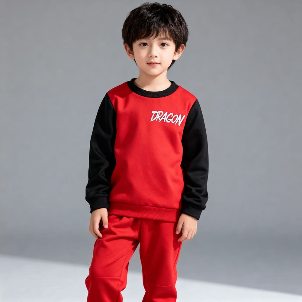 Red kids’ sweatshirt with “DRAGON” graphic and black contrast sleeves, paired with matching red jogger pants — bold, sporty outfit.