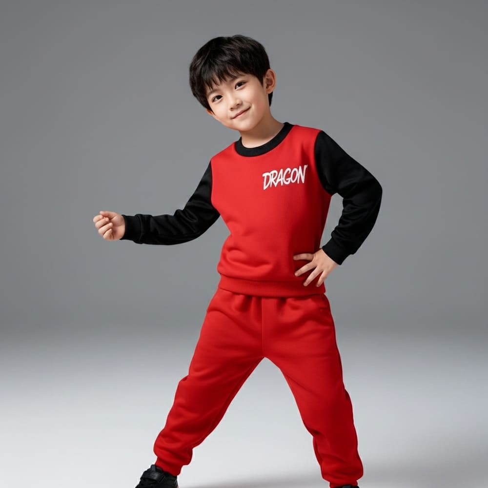 Red kids’ sweatshirt with “DRAGON” graphic and black contrast sleeves, paired with matching red jogger pants — bold, sporty outfit.