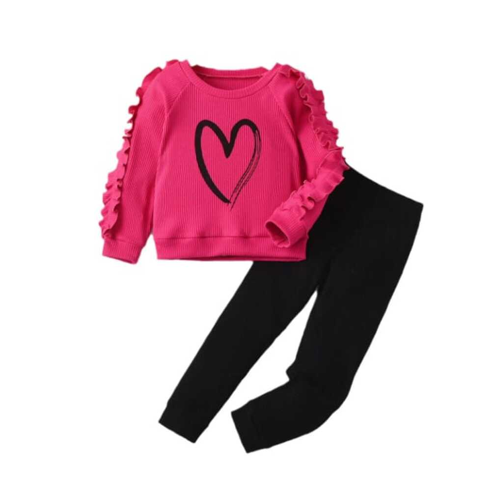 Bright pink ruffle-sleeve sweatshirt with black heart graphic paired with black leggings — cute, cozy outfit for girls.