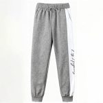 Gray long sleeve top and jogger pants with white side stripe and “Los Angeles” script — modern, minimalist outfit for boys or girls.