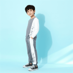 Gray long sleeve top and jogger pants with white side stripe and “Los Angeles” script — modern, minimalist outfit for boys or girls.