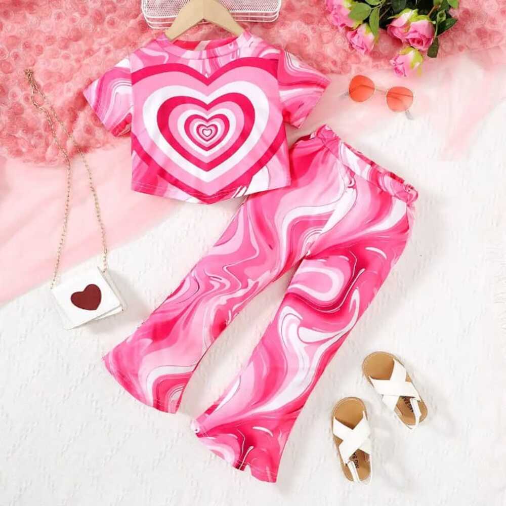 swirl-heart-set-front-styles-by-syl-1 Bright pink swirl heart print t-shirt and flared pants set — bold, playful outfit for girls who love to stand out.