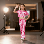 Bright pink swirl heart print t-shirt and flared pants set — bold, playful outfit for girls who love to stand out.