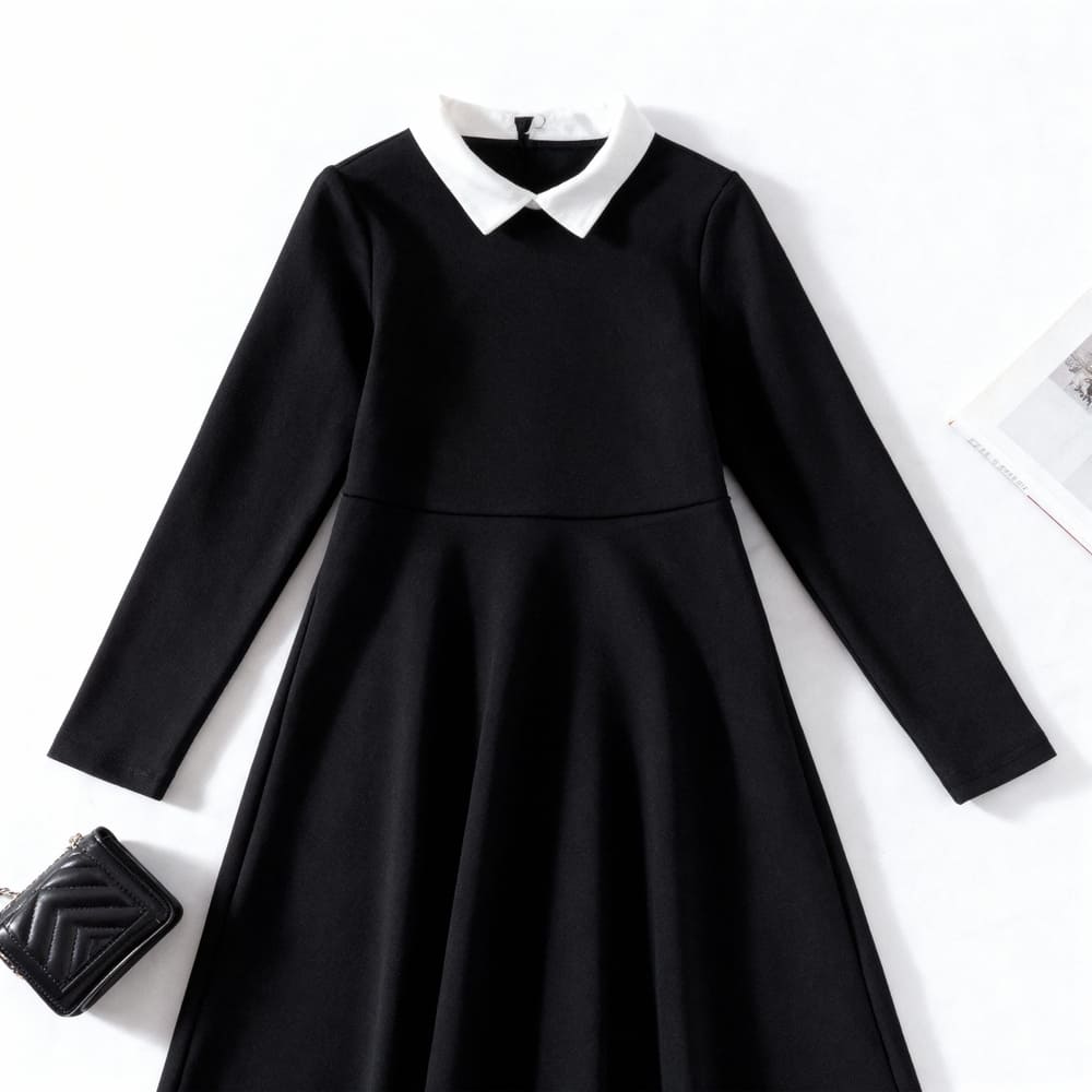 black-peter-pan-dress-styles-by-syl Black long-sleeve dress with white Peter Pan collar.