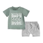 Green "Dad's Little Dude" tee and grey drawstring shorts