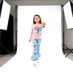 Pink “Oh The Places I’ll Go” top and blue balloon-print bell bottom pants