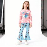 Pink “Oh The Places I’ll Go” top and blue balloon-print bell bottom pants
