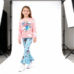 Pink “Oh The Places I’ll Go” top and blue balloon-print bell bottom pants
