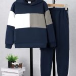 Boy wearing navy color block hoodie and matching joggers