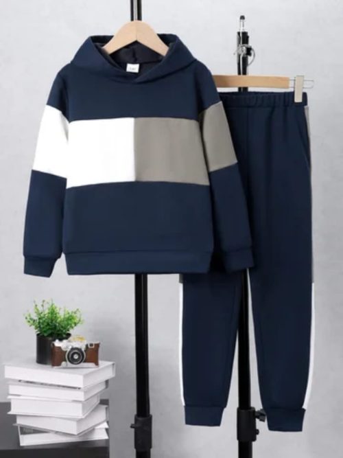 Boy wearing navy color block hoodie and matching joggers