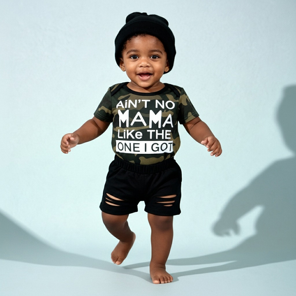 Camo bodysuit with “Ain’t No Mama Like The One I Got” + black shorts and hat