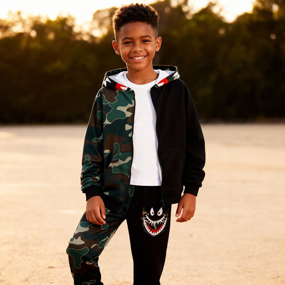 Green camo hoodie and black joggers with shark embroidery