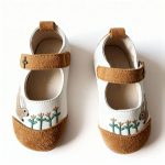 Girl’s white Mary Jane shoes with embroidered bunny and tan suede toe