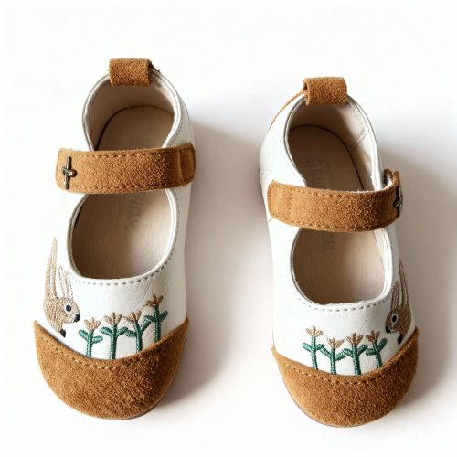 Girl’s white Mary Jane shoes with embroidered bunny and tan suede toe