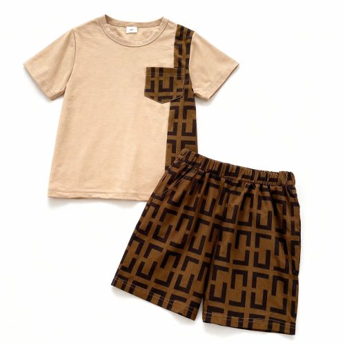 Boy wearing beige t-shirt with geometric pocket and matching patterned shorts