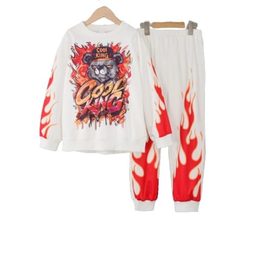 Boy wearing white hoodie with flame bear graphic and red flame pants