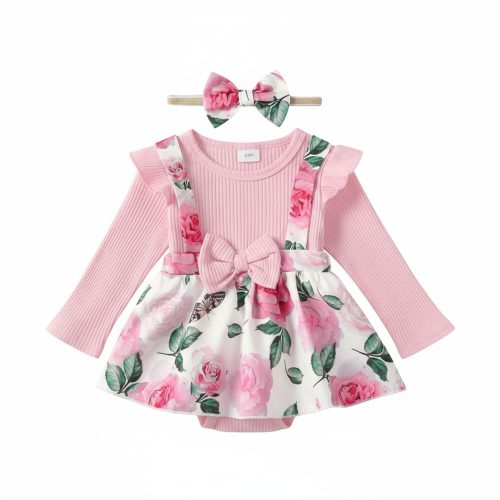 Girl wearing pink floral dress with bow and matching headband