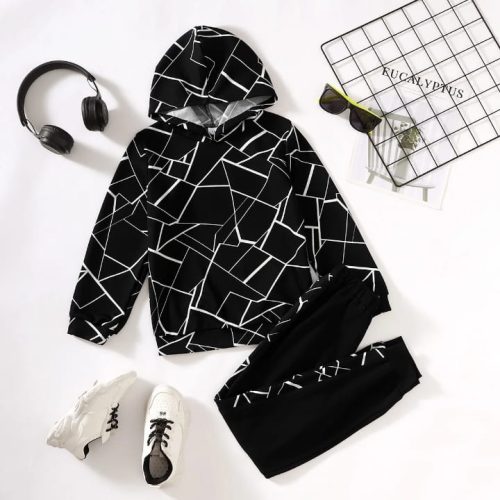 Boy in black hoodie with white geometric lines and matching joggers