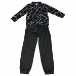 Boy in black geometric polo and matching joggers