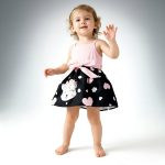 Pink ribbed bodice and black kitty print dress with bow