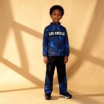 Blue lightning-print top and black joggers with lightning panels