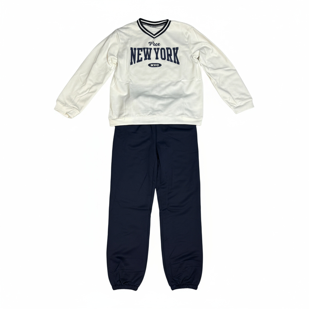 Boy in white v-neck “New York” sweatshirt and navy joggers