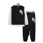 Boy in black-white color block sweatshirt with NY logo and black joggers