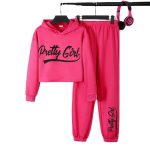 Girl wearing pink crop hoodie with “Pretty Girl” print and matching joggers