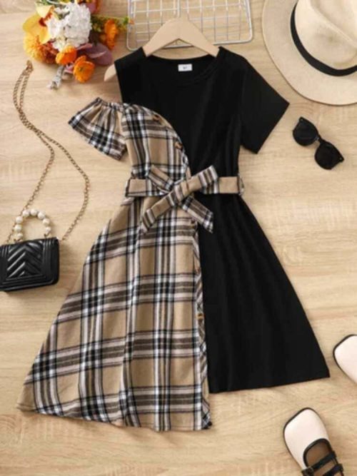 Girl wearing black and beige plaid asymmetrical dress with bow belt