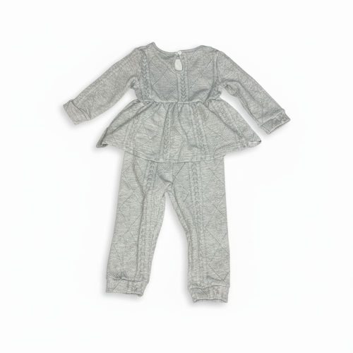 Girl wearing light gray quilted peplum top and matching pants