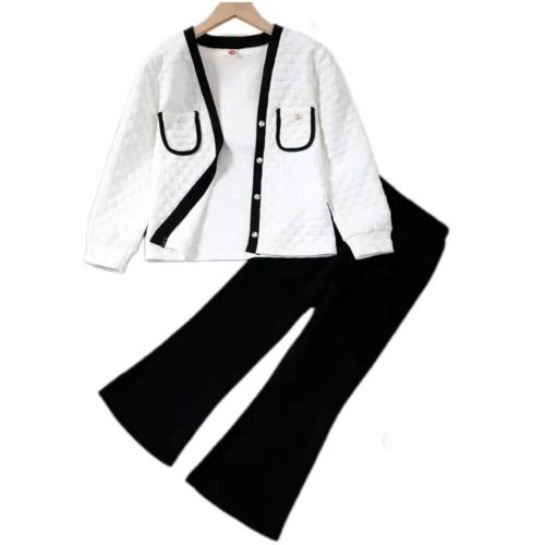 Girl wearing white quilted cardigan with black trim and black flare pants