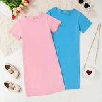 Girl wearing soft pink and bright blue short-sleeve dresses
