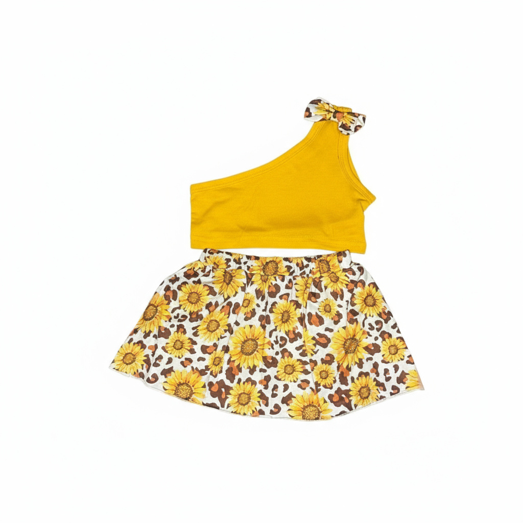 Girl wearing mustard one-shoulder top and sunflower-leopard skirt