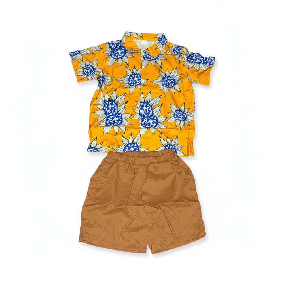 Boy wearing yellow sunflower shirt and brown cargo shorts