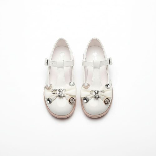 Girl’s white Mary Jane shoes with pearl bow and rhinestone details